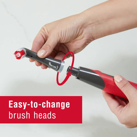Close-up of a hand changing brush head on Cordless Power Scrubber With Multi Purpose Head, Water Resistant Scrub Brush For Home Kitchen