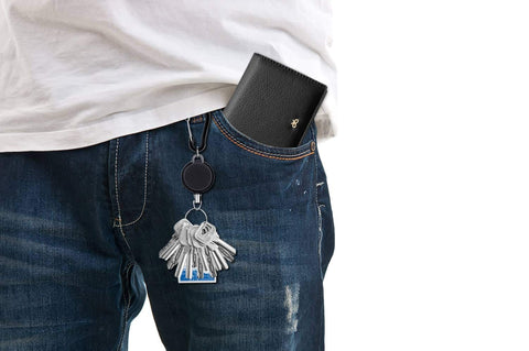 Man wearing jeans with Five Pack Retractable Keychain Badge Holders With Steel Wire Reel Clip Durable ID Badge Reels attached