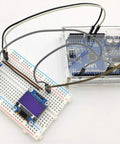 38 In 1 Sensor Module Kit for Arduino and Raspberry Pi projects with 0.96 inch OLED screen connected to breadboard and Arduino Uno