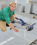 24 Inch Manual Tile Cutter With Tungsten Alloy Wheel And Double Rail Track For Ceramic Porcelain And Glass Cutting featuring a user in action.