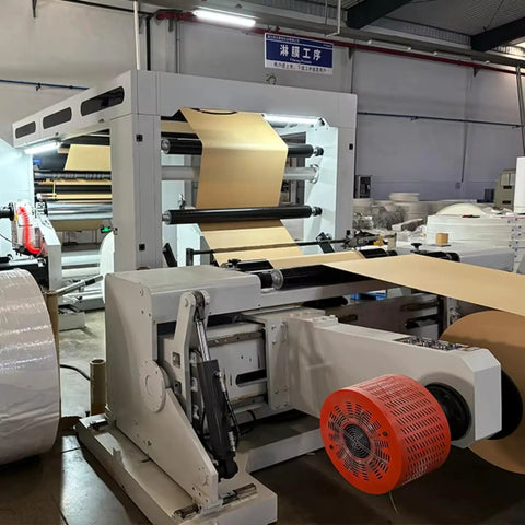 Industrial Smooth Operation Heavy Duty Automatic Jumbo Roll Slitter Machine Featuring Differential Slip Shaft For Insulation Paper Sheets and Job Ready Site Setup in production view.