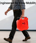 Man carrying a 5 Liter Fuel Storage Tank With Bleed Valve And Transfer Pump, Portable Gas Jug For Cars, Motorcycles, Boats And Outboard Motors, Includes Guide Pipe, Tough HDPE Construction For Safe, Easy Fuel Storage And On The Go Transport