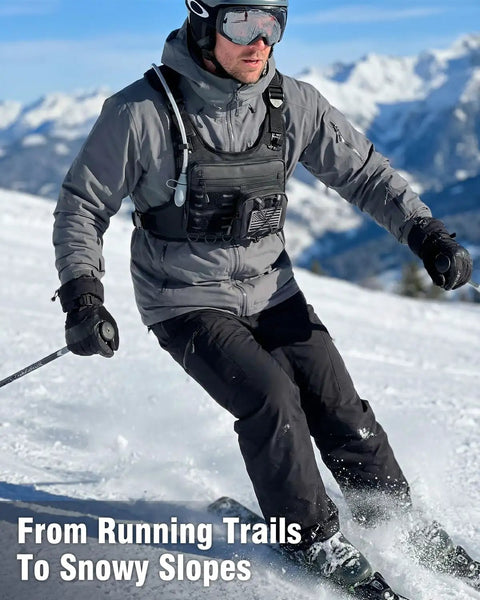 Man skiing wearing 2L Water Bladder Hydration Chest Pack For Running, Lightweight Vest, Black Camo, 12L M/L, snowy mountains