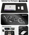 Leather Office Desk Pad Protector, Large Non Slip PU Leather Mouse Pad And Writing Desk Blotter, Waterproof Guard For Home And Office, Scratch Spill And Heat Resistant, 23.6 By 13.8 Inches, Black, shown with laptop and phone.
