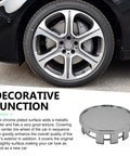 Set Of Four Sleek Silver Wheel Hub Center Caps With A Dead Snap Fit That Shuts Out Rain And Road Grit To Beat Rust On Those Exposed Bolts While Keeping Your Rim Setup Looking Fresh All Season Long - close-up of wheel hub cap with chrome finish on car wheel.