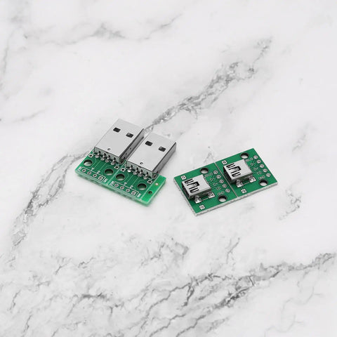 DIY Friendly USB To DIP Breakout Adapter Kit 18 Pcs with USB 2.0 and Mini USB connectors on marble background