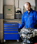 Mechanic using 5 Drawer Rolling Tool Chest With Casters And Locking System, 27-Inch Metal Tool Storage Cabinet, blue finish, in workshop