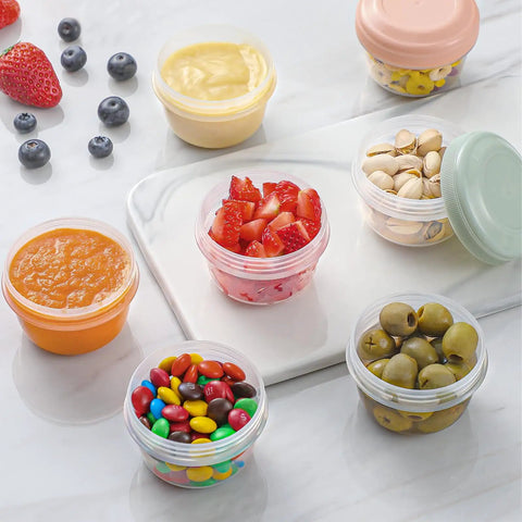 16 Pack 4 Ounce Reusable Plastic Jars With Lids For Snacks And Purees On The Go Salad Dressing Containers Deli Storage Freezer Baby Food Containers Dishwasher Safe And BPA Free filled with fruit, nuts, and olives
