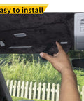 Slick Magnetic Leather Sunglasses Holder for Car Visor Clip being installed, showing one hand and dashboard view.