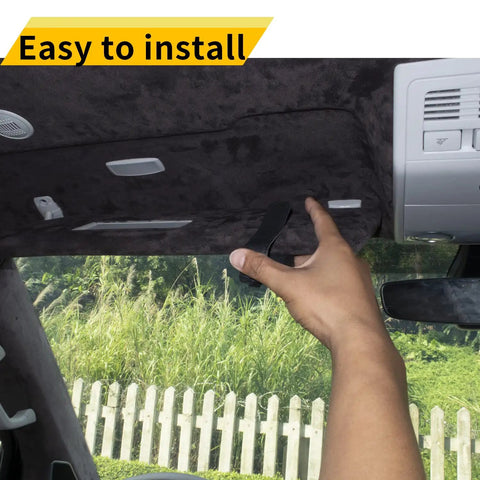 Slick Magnetic Leather Sunglasses Holder for Car Visor Clip being installed, showing one hand and dashboard view.