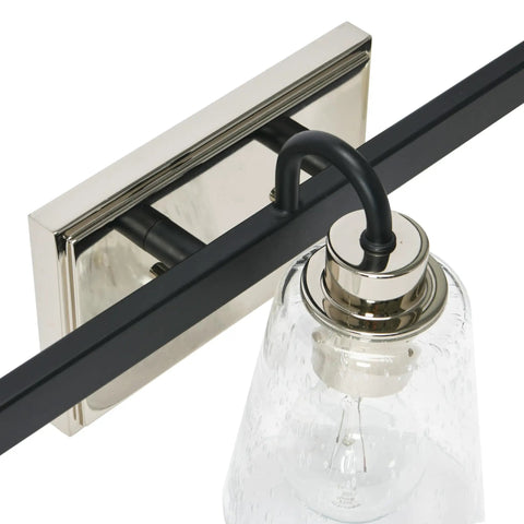 Three Light Vanity Fixture With Seeded Glass Diffusers Matte Black Finish With Polished Nickel Accents detail view