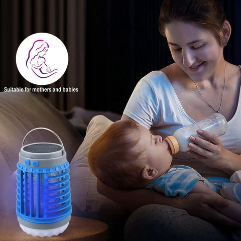 Mother feeding baby with Solar Powered Outdoor Bug Zapper That Is Waterproof Portable And Rechargeable With USB Charging nearby.
