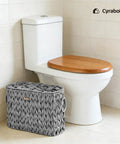 Toilet Paper Storage Basket With Lid Made From Water Hyacinth Wicker Built In Handles Holds Up To 6 Mega Rolls in bathroom