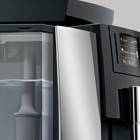 Top Shelf Smart Coffee Machine Water Filter With Integrated Rfid Chips Removes Limescale Heavy Metals And Chlorine Extends Appliance Lifespan For Slick Daily Brewing close-up of grey Jura brewing machine with water reservoir.