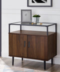Modern wooden cabinet with black handles and glass shelf in living room.