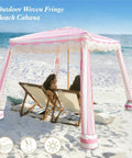 Boho Beach Cabana With Fringe And Tassels, 7x7 Ft Easy Setup Canopy With Premium Wood Poles, Sand Pockets, Rose Stripes on beach