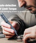Man using Cordless Mini Electric Screwdriver Set With 28 Magnetic Bits, 3 Gear Torque, to repair delicate electronics.