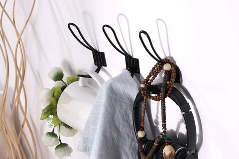 Rustic Entryway Hooks 10 Pack Black Wall Mounted Vintage Double Coat Hangers holding accessories on wall