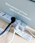 Heavy Duty 15 Ft Extension Cord With Flat Plug For Tight Spaces Behind Furniture And Desks in use on power strip