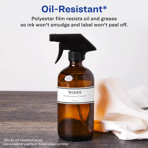 Slick Waterproof Wraparound Rectangle Labels Matte White 1-1/4 X 9-3/4 Inches on amber spray bottle with black sprayer.