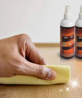 Hand polishing wood surface with Wooden Repair Spray Quick Fix Scratch Remover For Tables Beds Floors 120Ml Instant Repair Paint.