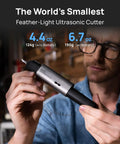Man holding Feather-Light Wireless On The Go Ultrasonic Cutter With 40kHz Vibration And 40W Auto Power, showing size and grip.