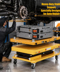 Image of a mechanic using a 2600 lbs Heavy Duty Electric Scissor Lift Table With Smooth Hydraulic Operation And Quick Tilt Adjustments for auto repair.
