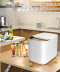 Compact countertop ice maker machine, 34cm height, 40cm width, 28cm depth, producing nine crisp ice cubes in six minutes.