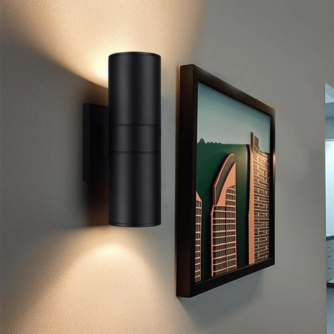 Exterior Up Down Outdoor Wall Lights With Remote Control RGB Color Changing 1200 Lumen Warm White mounted on wall next to picture frame.