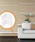 8 Piece Rubber Furniture Angle Foot Pads And Corner Protectors For L Shaped Edges in a modern living room setting with couch.