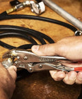 Person using 7-inch Curved Jaw Locking Pliers With Wire Cutter Set For Home DIY And Pros on cable, demonstrating heavy-duty grip.