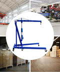 Heavy Duty 2 Ton Folding Engine Hoist Cherry Picker Jib Crane on smooth rolling swivel casters in a garage setting.
