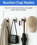 Heavy Duty Black Suction Cup Hooks Two Pack No Drill Bathroom Wall Adhesive Rack For Towels Robes And Fitness Gear Featuring Hella Strong Silicone Base holding a coat, bag, umbrella, and hat.
