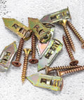 Heavy Duty Self Drilling Drywall Anchor Screw Kit For Plasterboard Mounts With Matched Metal Expansion Screws High Load Bearing For Shelves Frames And Lightweight Fixtures Your Go To For Easy Home Improvement Projects. Metal drywall anchors with screws on a white surface