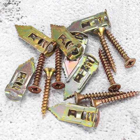Heavy Duty Self Drilling Drywall Anchor Screw Kit For Plasterboard Mounts With Matched Metal Expansion Screws High Load Bearing For Shelves Frames And Lightweight Fixtures Your Go To For Easy Home Improvement Projects. Metal drywall anchors with screws on a white surface