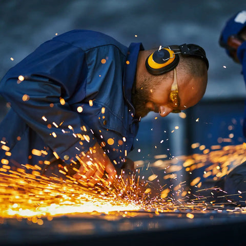 Person welding with sparks flying, using 4 Pcs Hot Rolled ASTM A36 Steel Plates Half Inch Thick 4X4 Inch Flat Metal Plates Square for DIY Metalworking