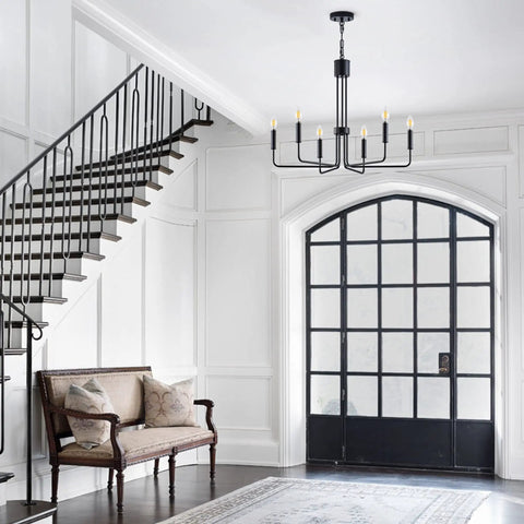 Matte Black Farmhouse Chandelier With Six Lights Modern Industrial Candle Pendant in elegant foyer.