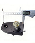 Caliper measuring Lincoln 90i Wire Feed Motor Replacement For MIG Welders 24V DC 10W, on white background.
