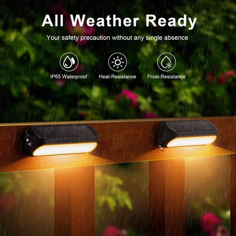 Solar Fence Lights Outdoor Waterproof 4 Pack With Warm White And RGB Color Changing Modes glowing on a rainy fence.