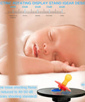 JAYEGT Motorized Rotating Display Stand, 10-Inch Mirror Finish Turntable showcasing a pacifier atop a sleek black base.