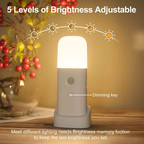 Motion Sensor Night Light Dimmable With 5 Brightness Levels, 2000mAh Rechargeable Battery on table with dimming key