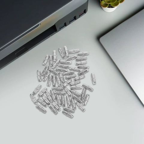 100 Pack Straight Up Sturdy Shelf Pegs For Wood Shelving Heavy Duty Metal Support Pins scattered on a desk near a printer.