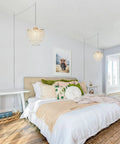 Straight Up Gold Plug In Pendant Light With 16 Foot Long Cord And Sparkling Three Tier Crystals For Kitchen Island Or Cozy Bedroom Setup Premium Slick Mini Chandelier Drip hanging above a cozy bed in a well-lit bedroom.