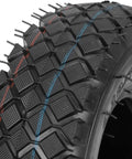 Close-up of 4.10/3.50-4 tire tread, showing rugged rubber with colored groove lines for 2 Pack 4.10/3.50-4 Tire Inner Tubes With Bent Valve Stem.