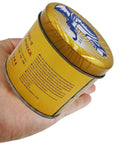 Person holding a yellow can with blue graphics and Chinese text; product details in red and black on side of can.