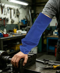 Heavy Duty Flame Resistant Welding Sleeves 21 Inch Blue Cotton Arm Guards with stretch bands, worn while using machinery.