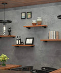 Heavy Duty 8 Inch Black Shelf Brackets Set Of 4 Industrial Floating Wall Mounted Shelving Supports on gray wall with decor