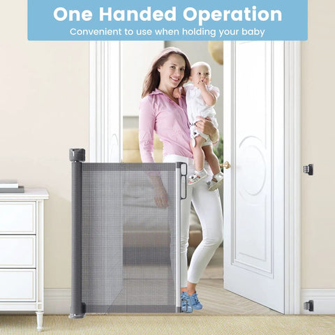 Mother holding baby using Retractable Baby Gate For Stairs And Doorways With Upgraded Double Lock 34 Inch Tall Extends Up To 72 Inch Wide Mesh Pet Gate.