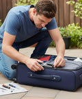 Man repairing suitcase zipper using 6 Piece Metal Zipper Pull Replacement Kit For Luggage And Travel Gear With Durable Zipper Heads