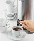 Person using 40 Cup Coffee Urn For Office And Events With Fast Brew Aluminum Construction Keep Warm Function Heat Resistant Handles